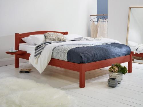 red wooden platform bed by get laid beds