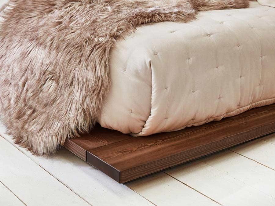 wooden low attic bed close up coffee bean