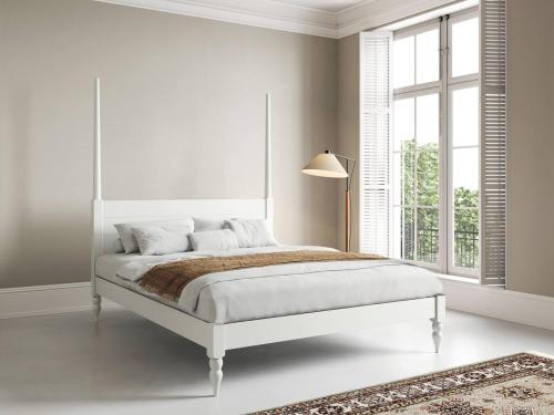 white moroccan four poster platform bed