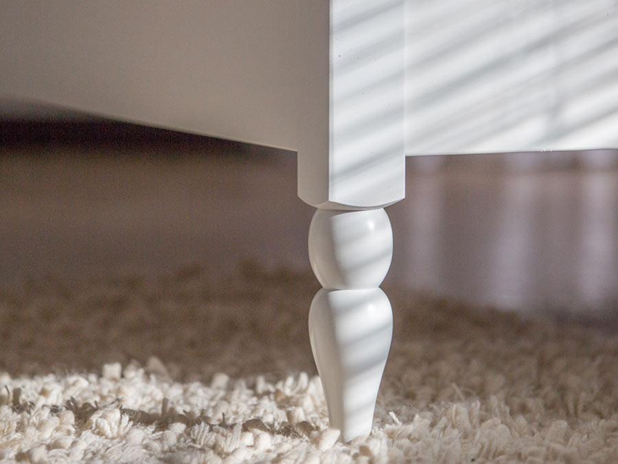 white wooden turned leg