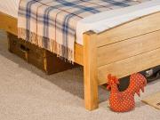 traditional wooden country bed side